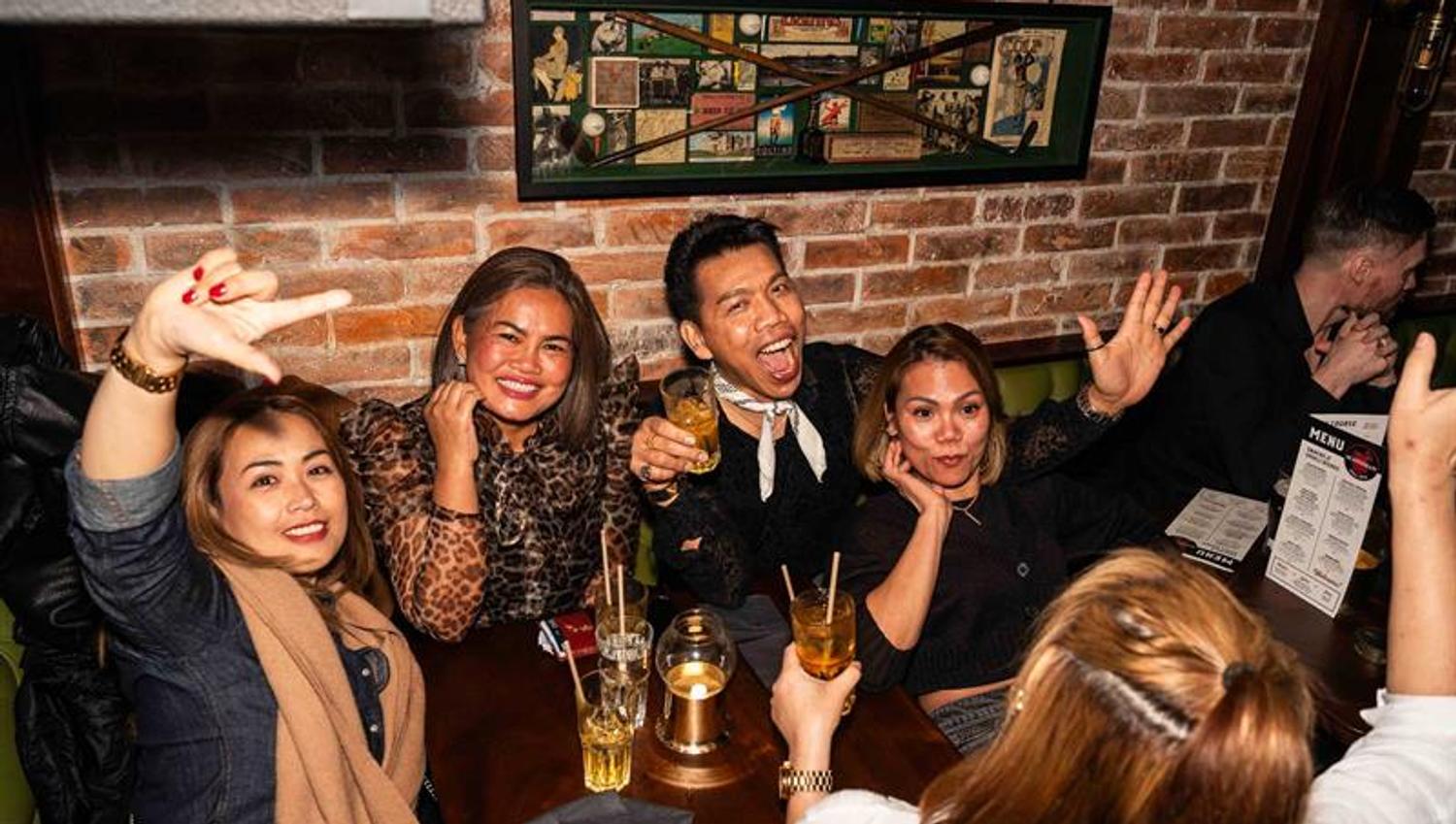 People enjoying themselves in a booth