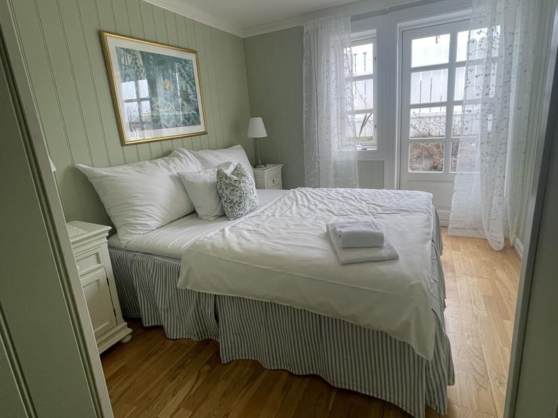 Green bedroom with bed