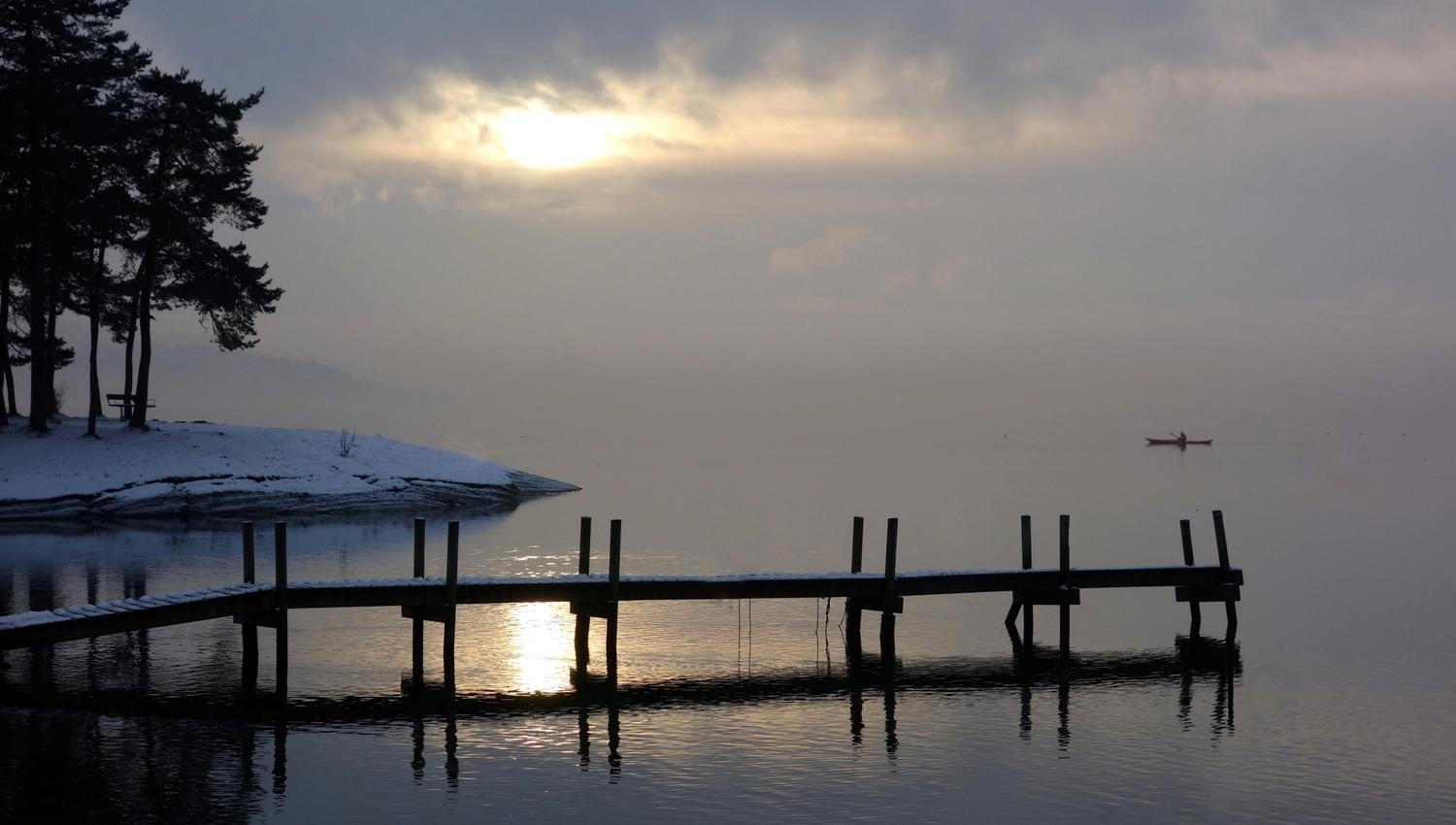 Overcast sky during winter and a pier.
