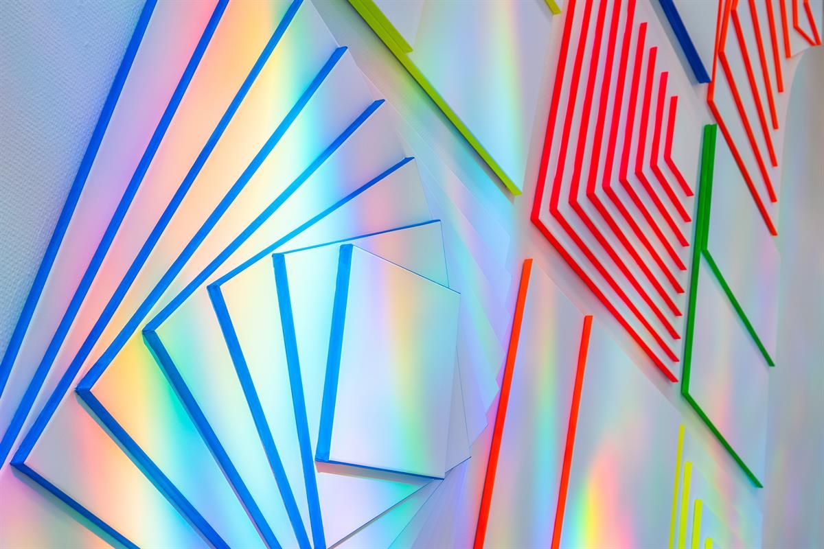  Colorful geometric art panels with light reflections.