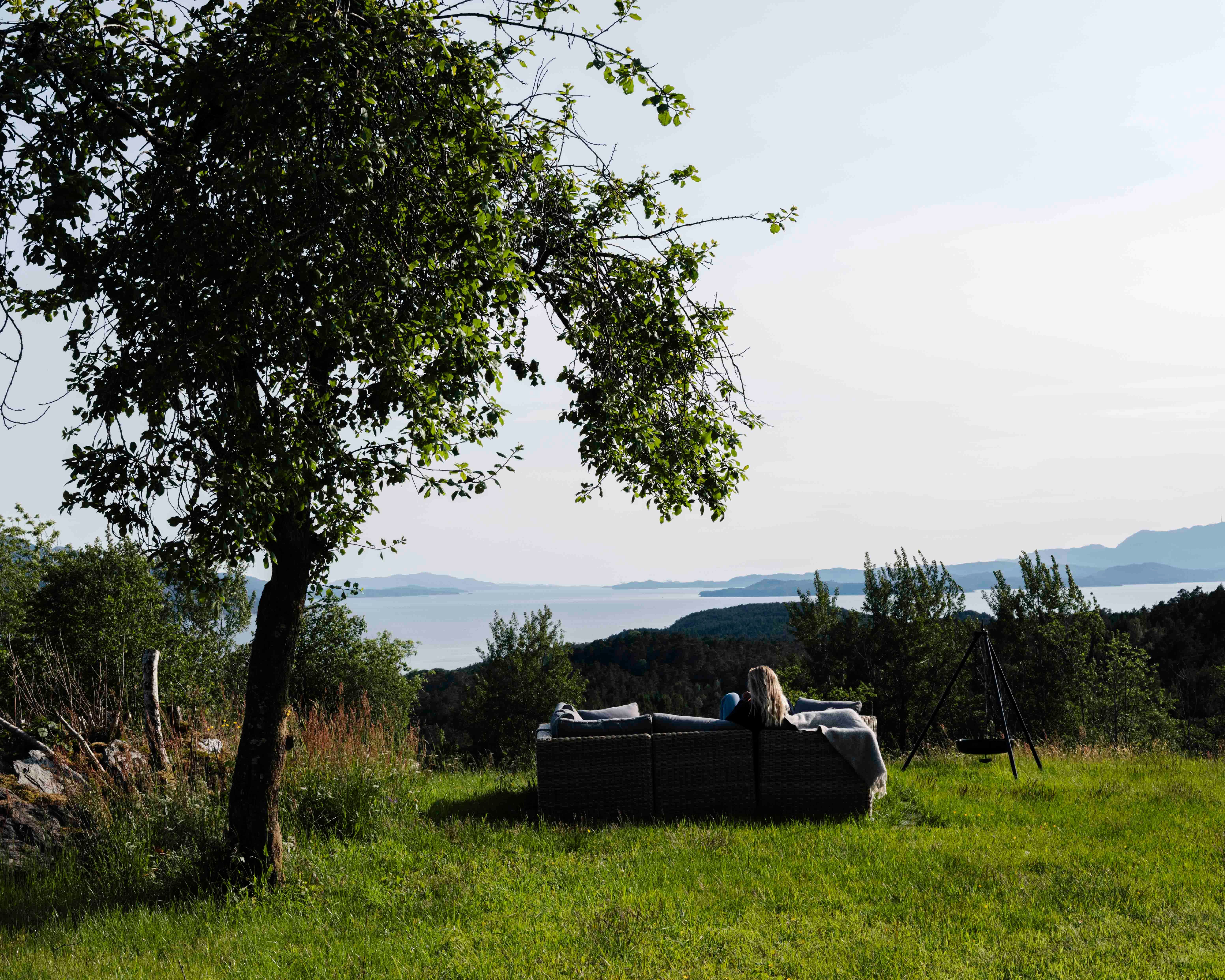 Enjoying the fjord view from the outdoor lounge at Stigen Fjordlodge in Hardanger.