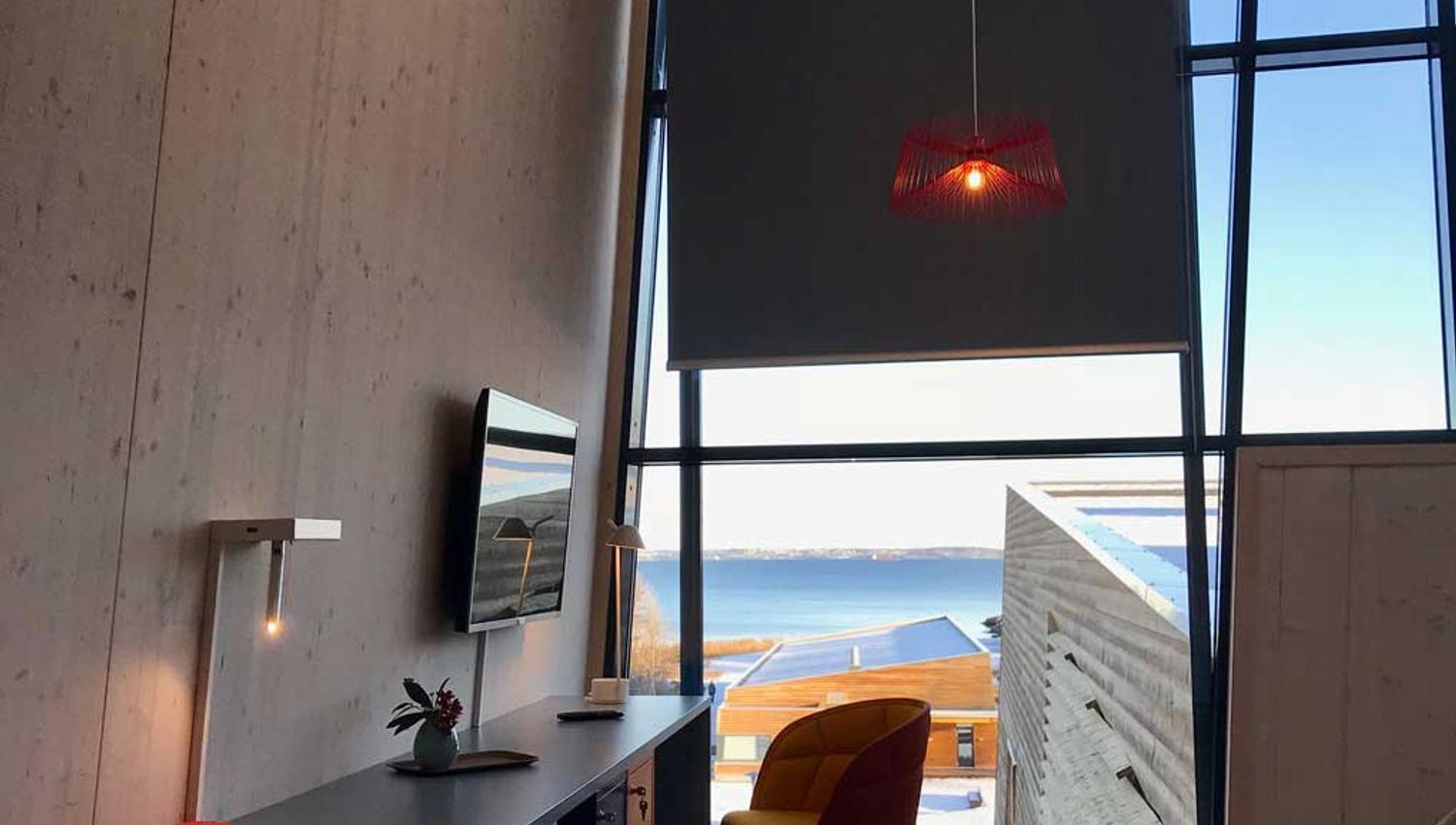 Hotel room, desk and chair, window with a view