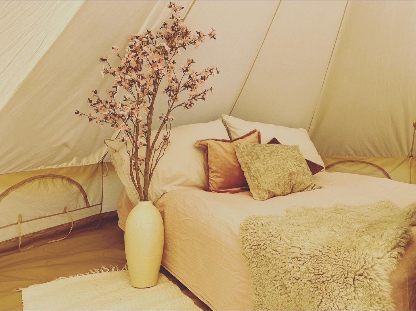bed in glamping tent at Bolkesjø Gård