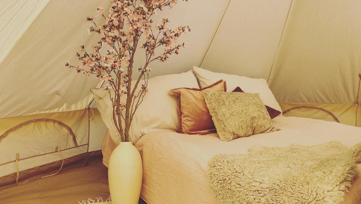 bed in glamping tent at Bolkesjø Gård