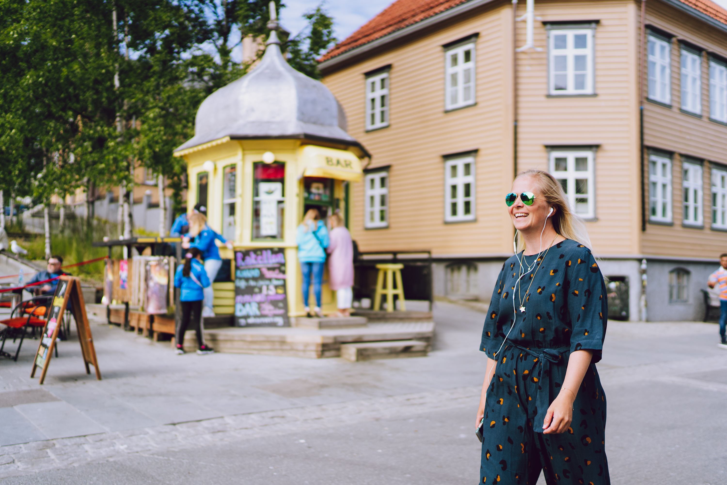 Girl walking past the Rocket Kiosk