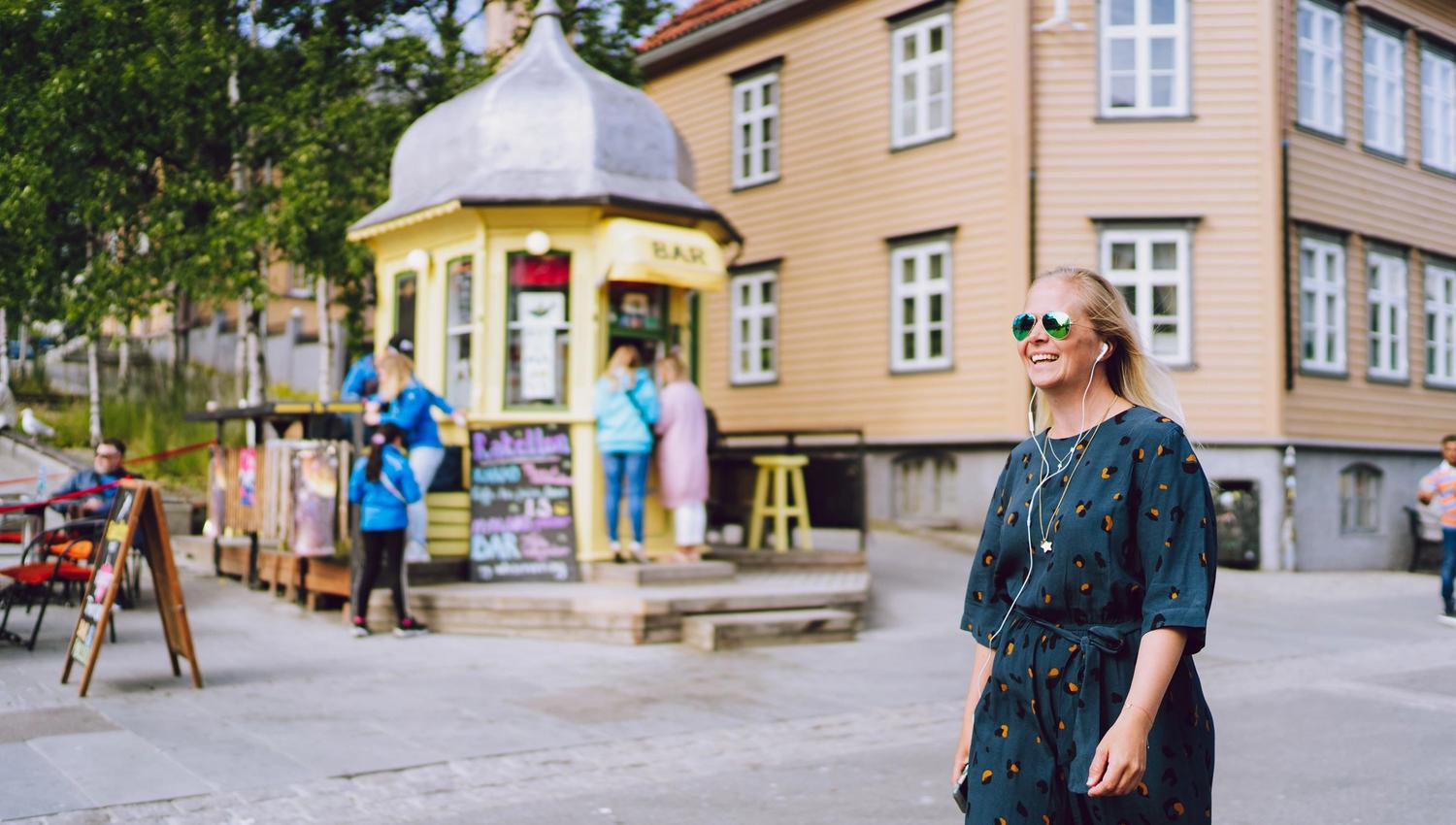 Girl walking past the Rocket Kiosk