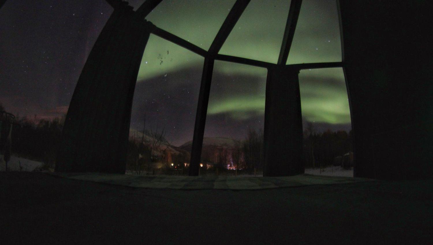Northern lights from glass iglo at North Experience