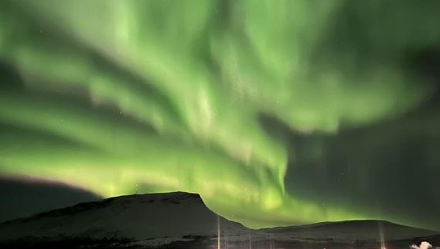 The Northern Lights cover the sky in a brilliant display of colours