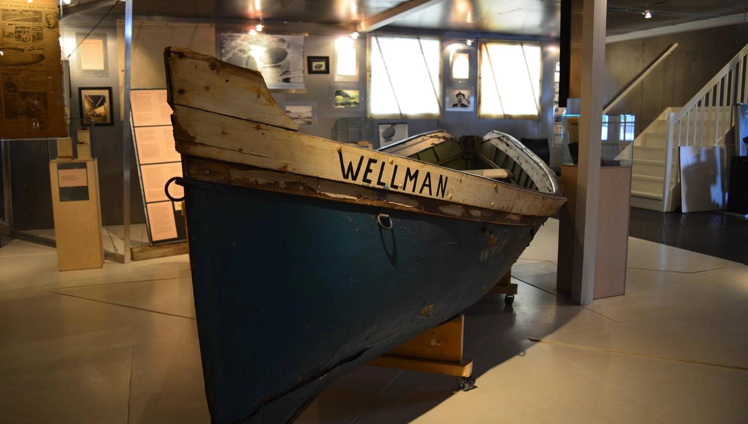 A boat that is part of the exhibition inside the museum
