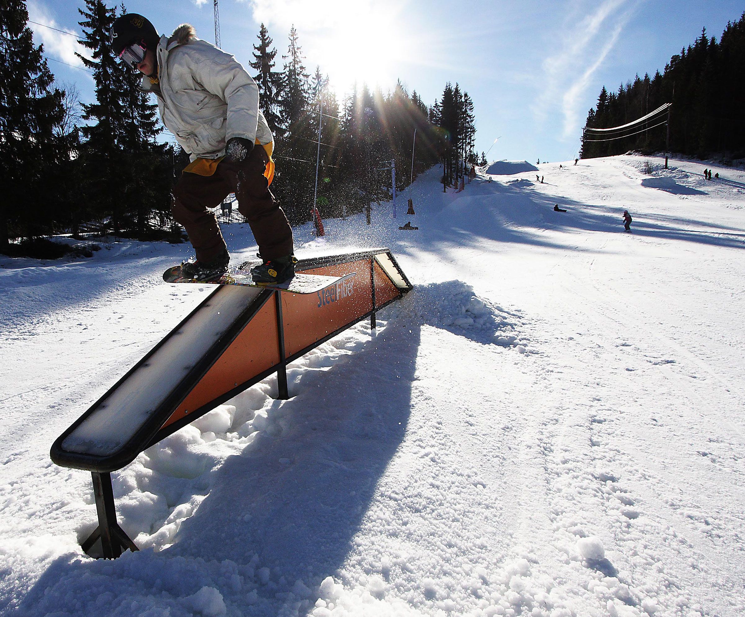 a person on a snowboard doing tricks