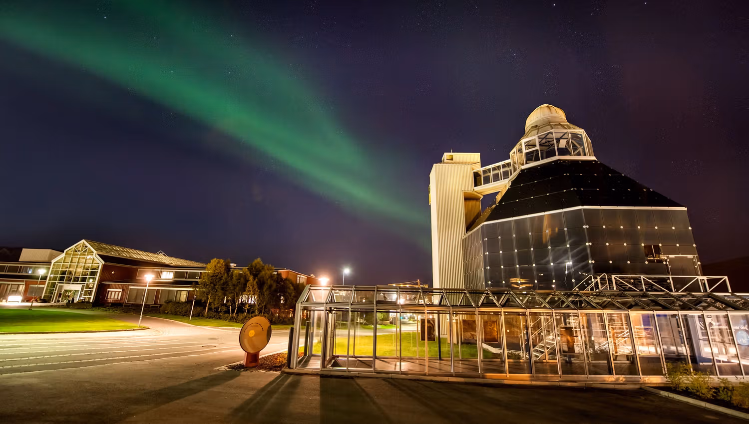 View of the Science Centre from the outside, under the Northern Lights