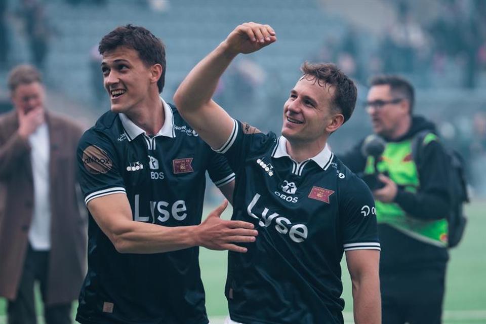 Two Viking players celebrate a victory