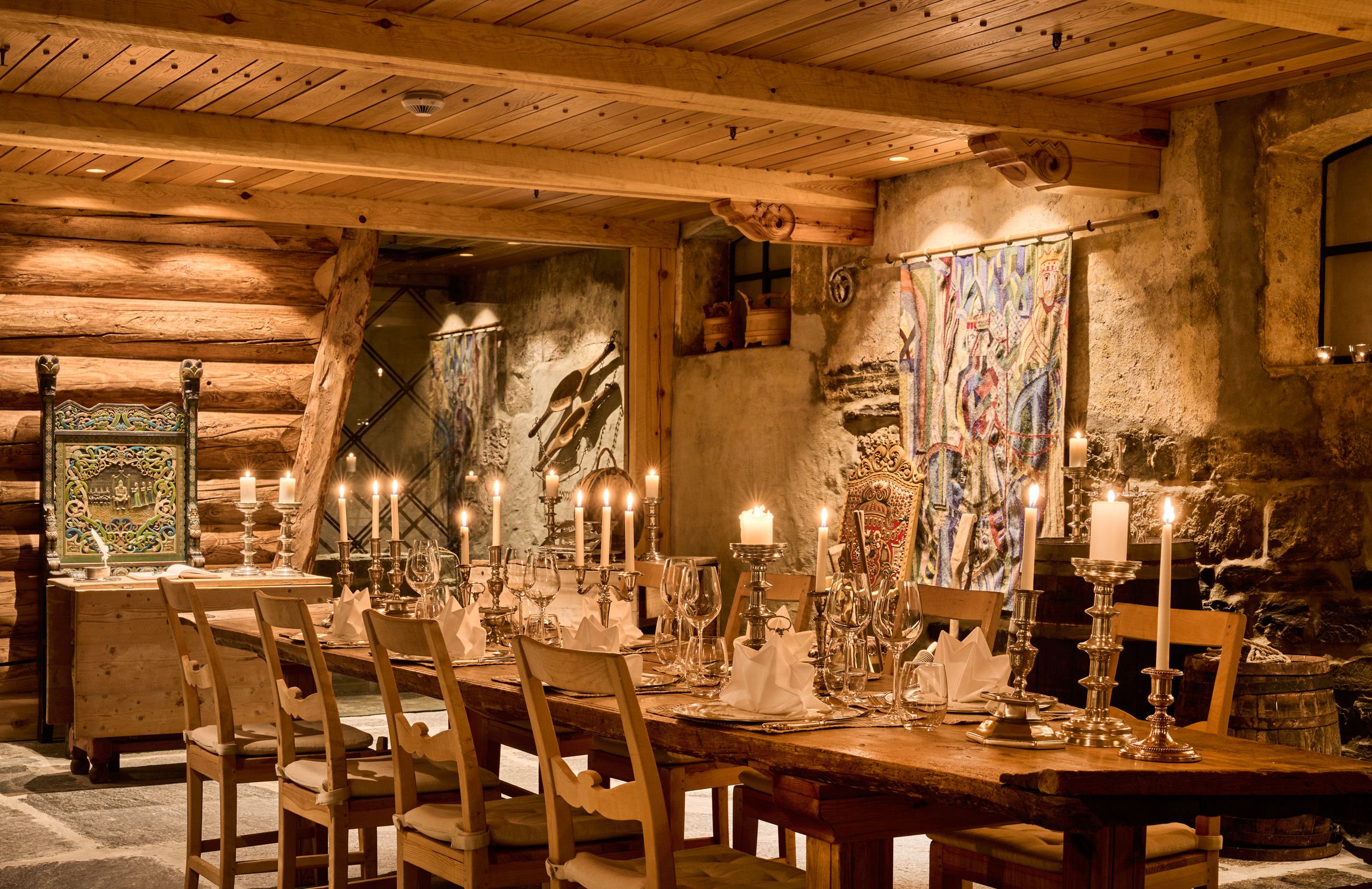 Historic wine cellar and dining venue with log and stone interiors at Hotel Ullensvang.