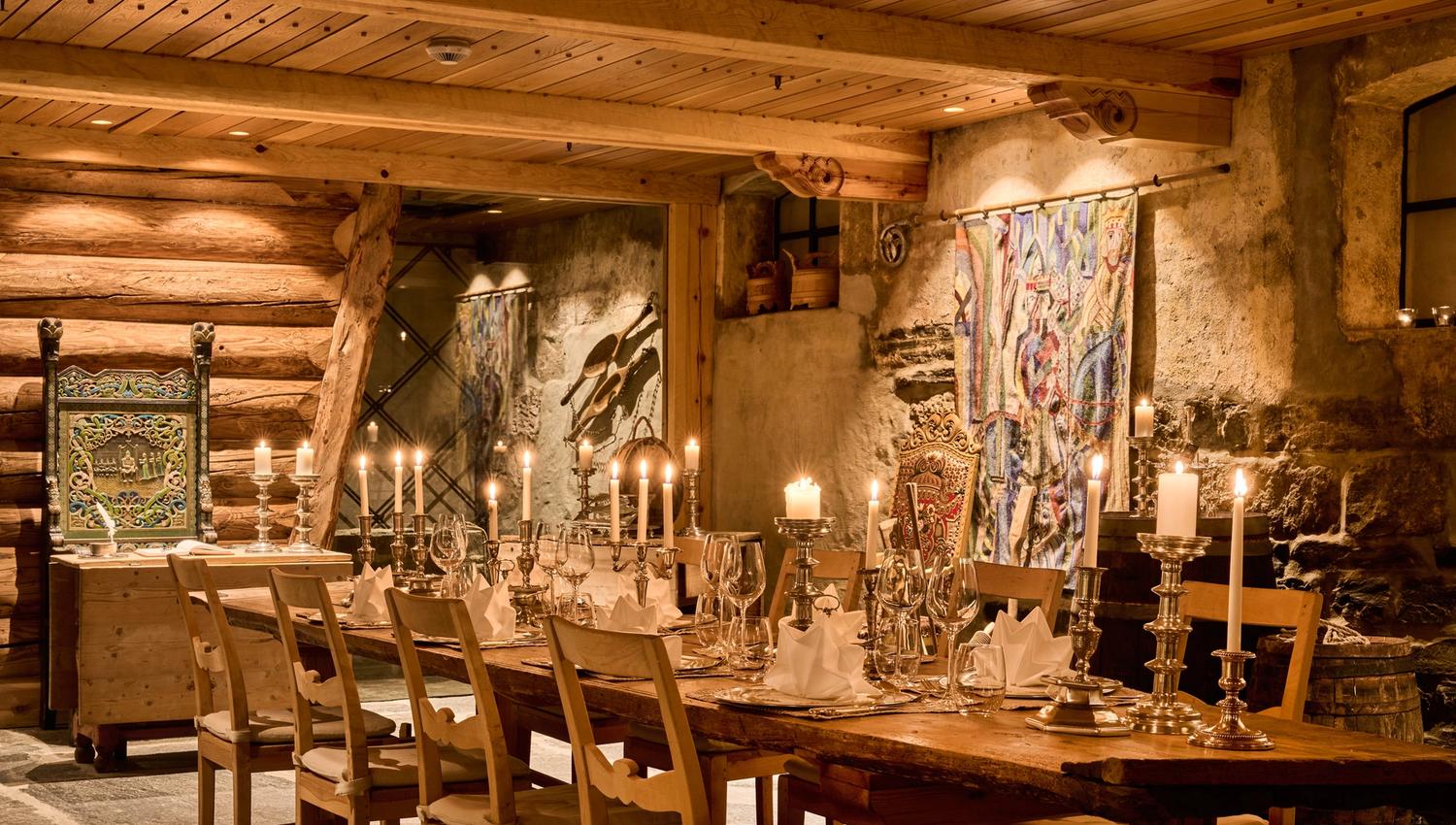 Historic wine cellar and dining venue with log and stone interiors at Hotel Ullensvang.