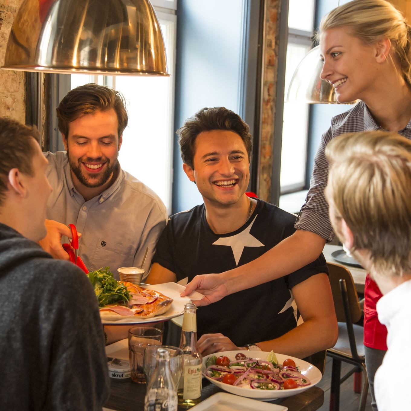 Smiling guests getting their food