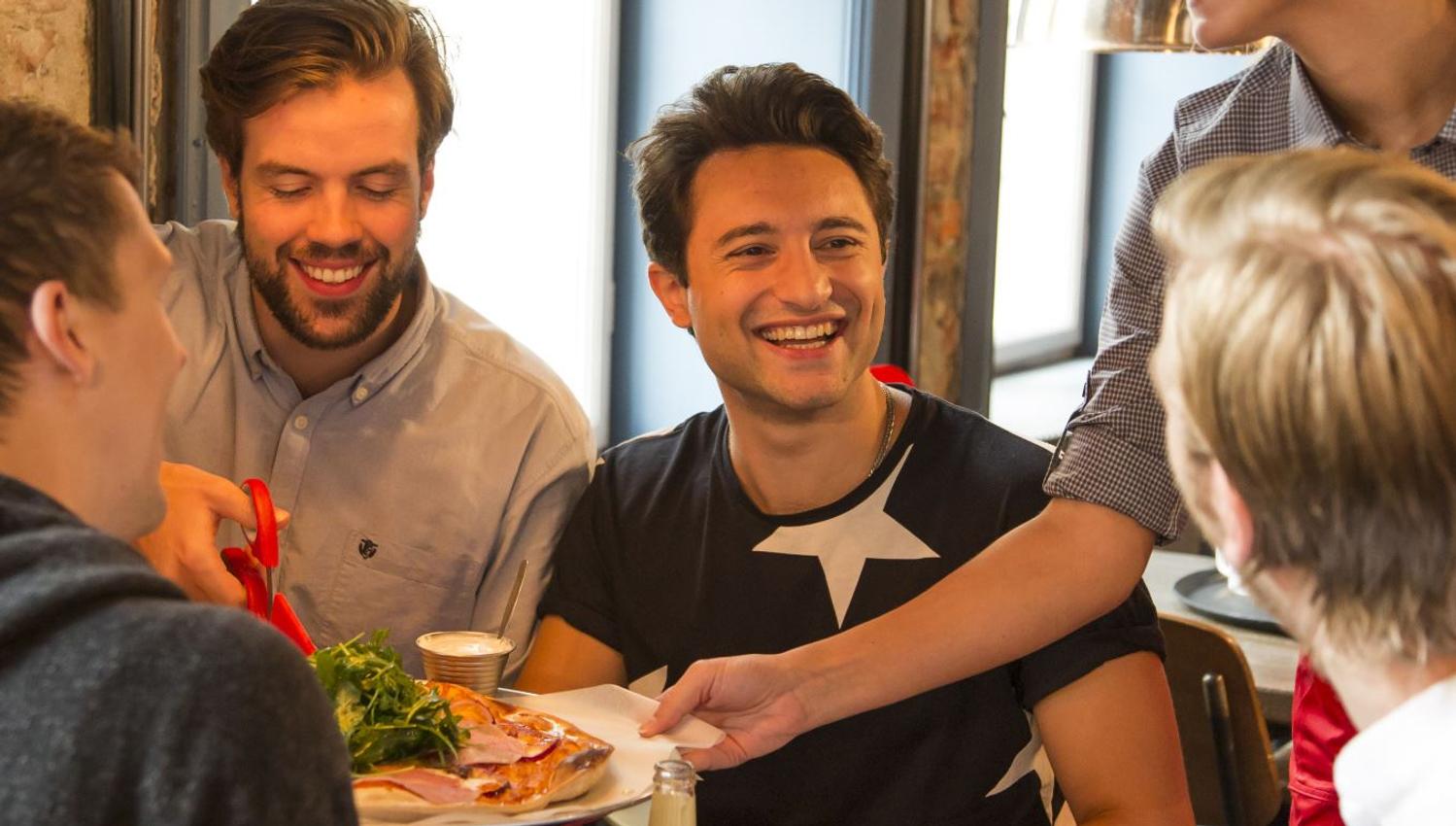 Smiling guests getting their food
