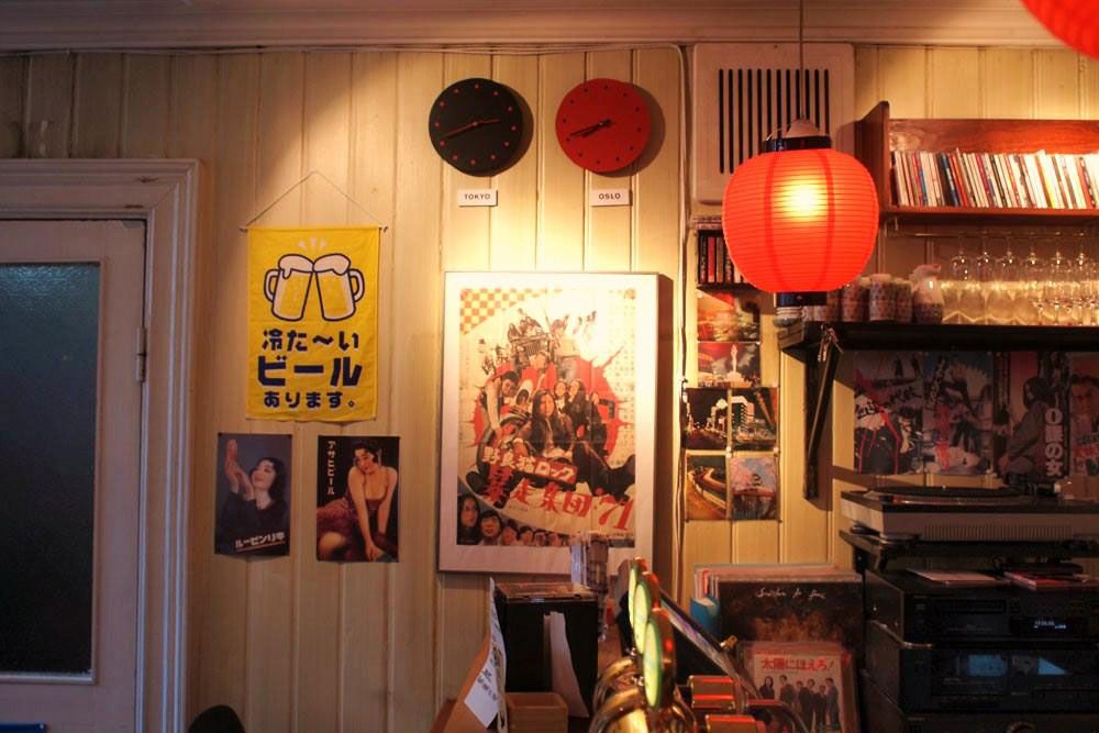 Various Japanese posters and a rice lamp.