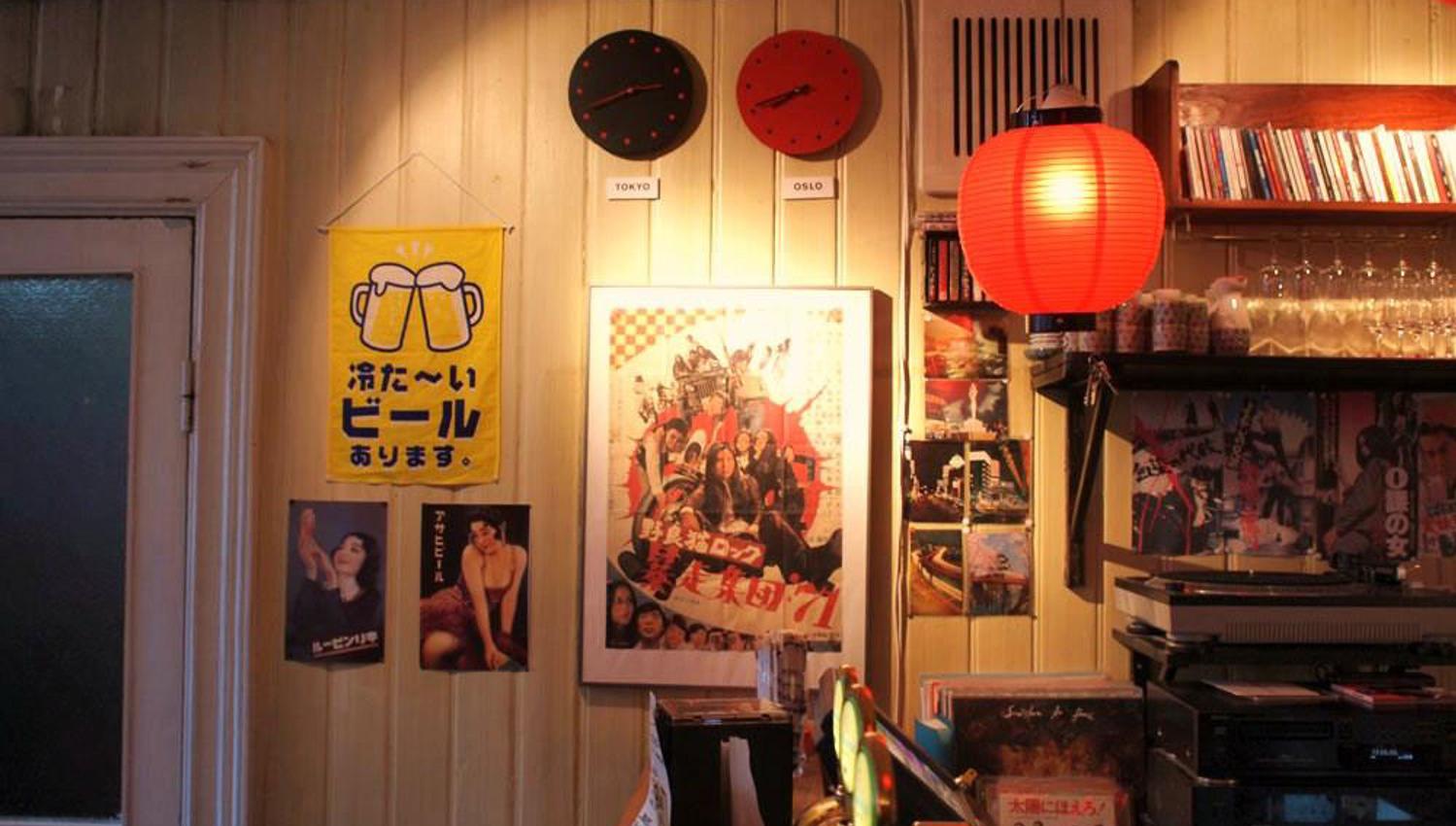 Various Japanese posters and a rice lamp.