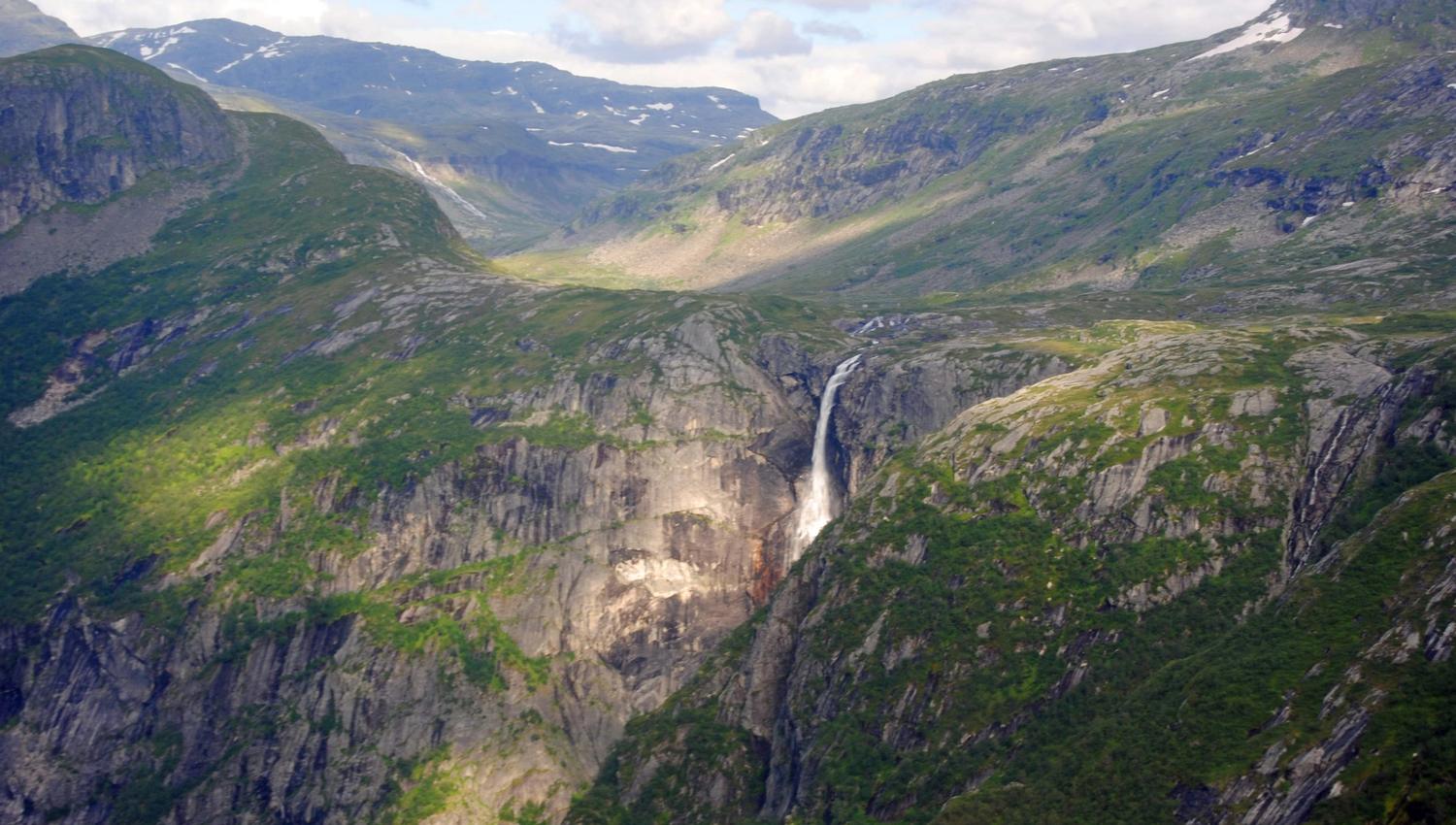 Skytjefossen waterfall seen from a helicopter.