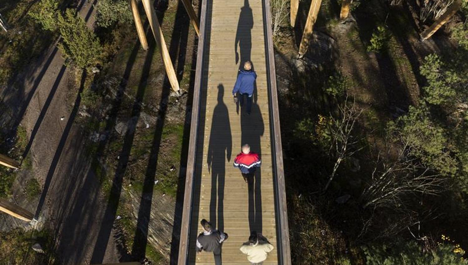 people walking on the tower from a bird's eye view