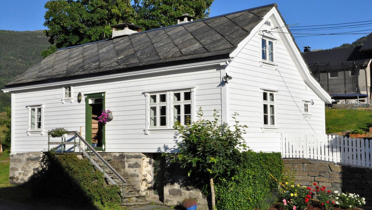 An older wooden house painted white