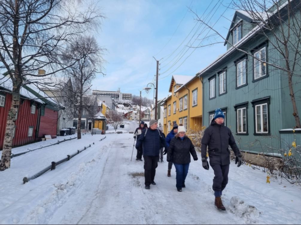 Guests walking outside in the street during winter