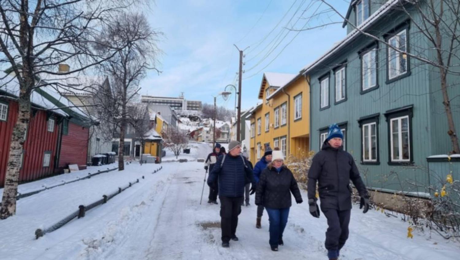Guests walking outside in the street during winter