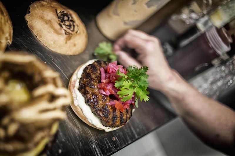 Preparing the burger.