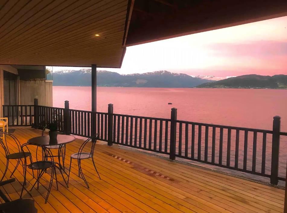 Magical sunset over the Hardangerfjord from a spacious terrace – the perfect place to enjoy the evening.