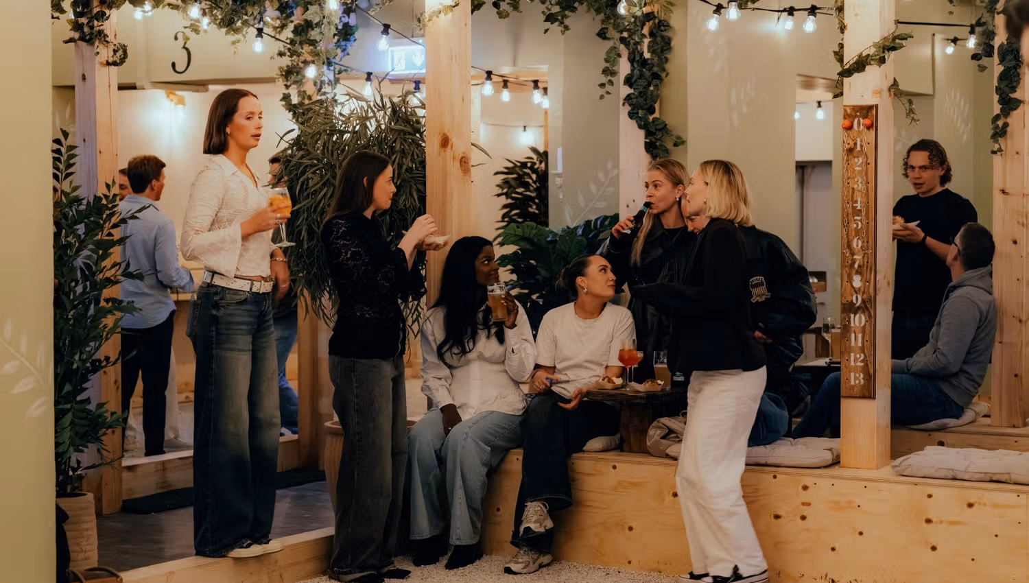 A gang of girls drinking wine and playing boule