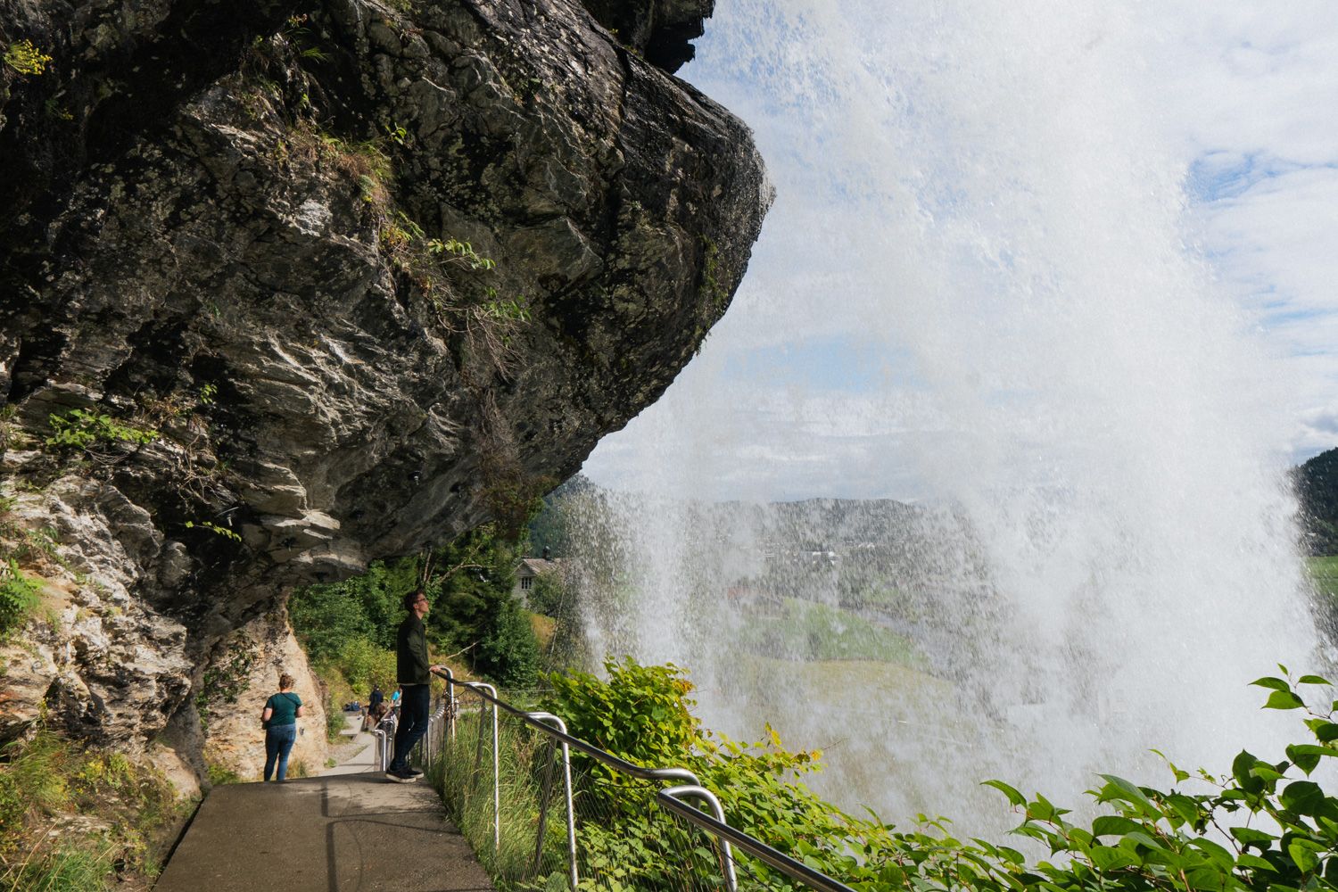 Path leading behind Steinsdalsfossen – a magical nature experience.