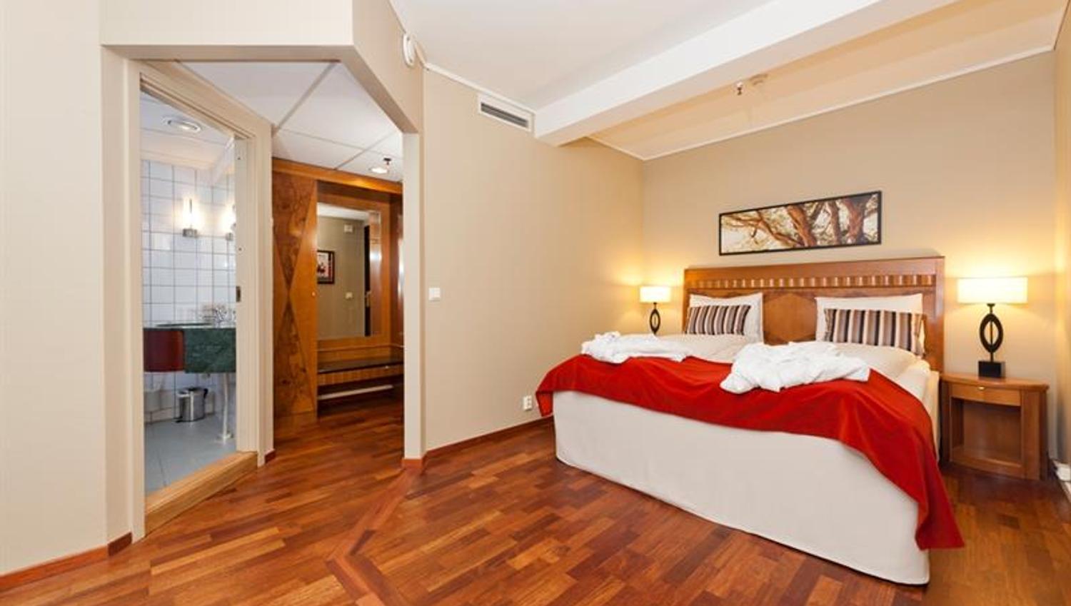 Room with twin bed and bathroom