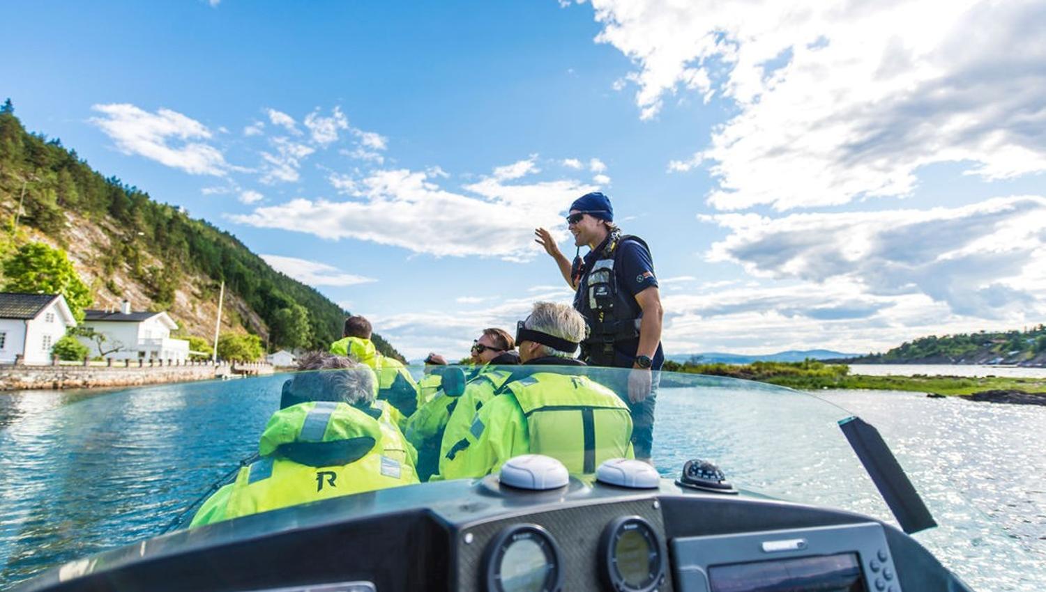 RIB pilot guiding passengers in the Oslo Fjord