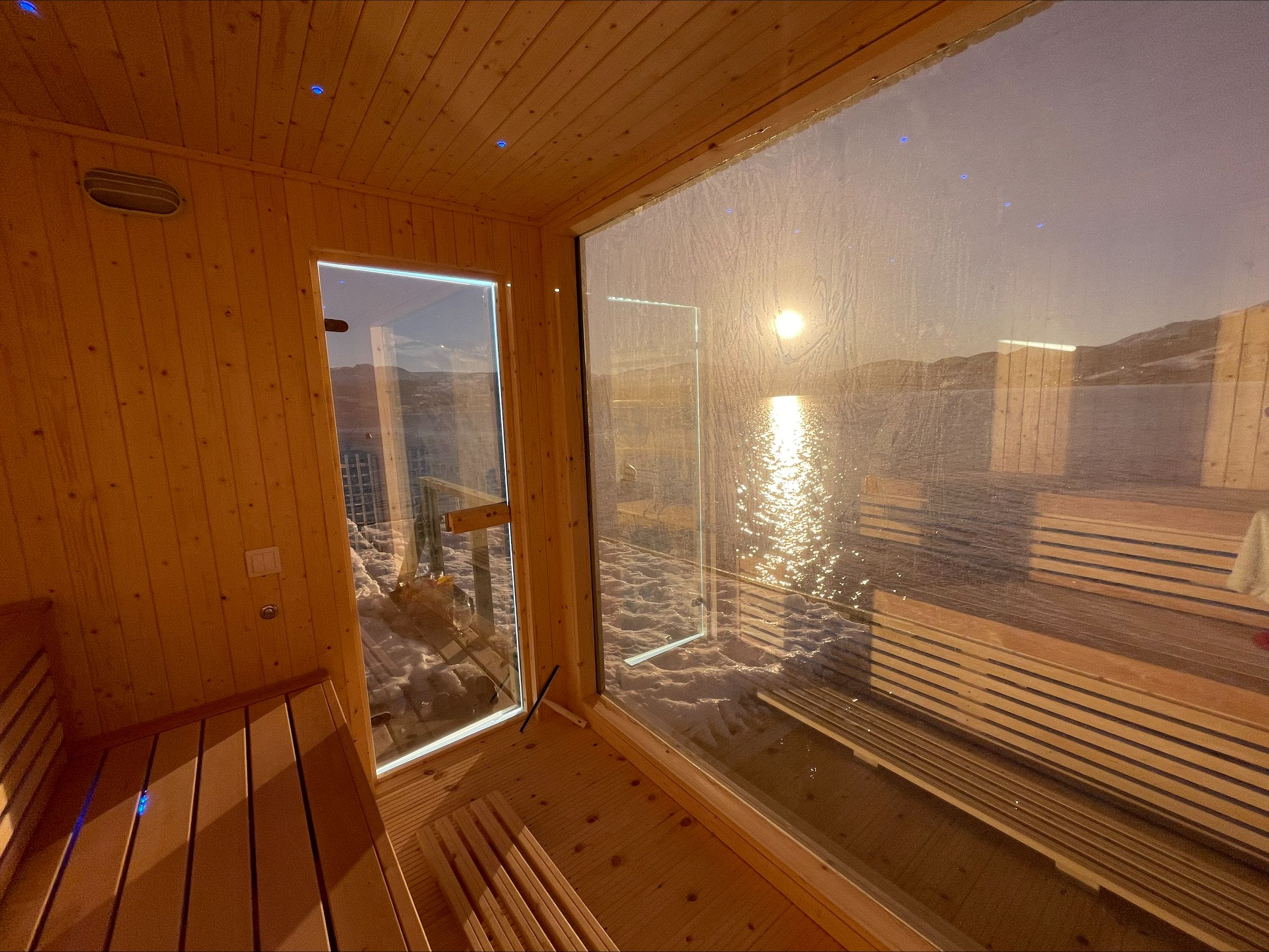 Enjoy a relaxing sauna experience with panoramic views of the Hardangerfjord. Perfect for wellness and tranquility.