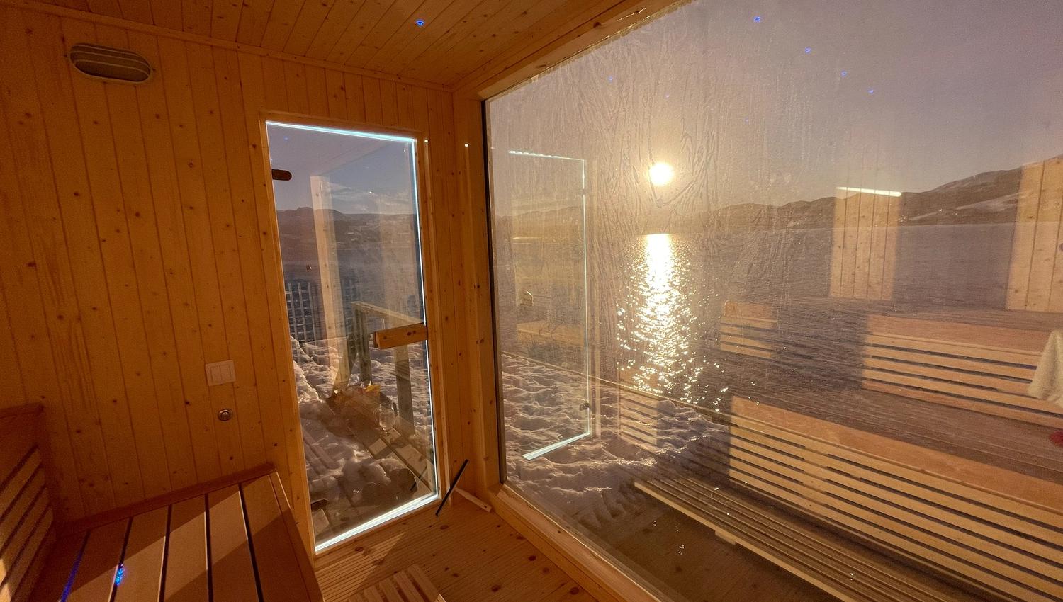 Enjoy a relaxing sauna experience with panoramic views of the Hardangerfjord. Perfect for wellness and tranquility.