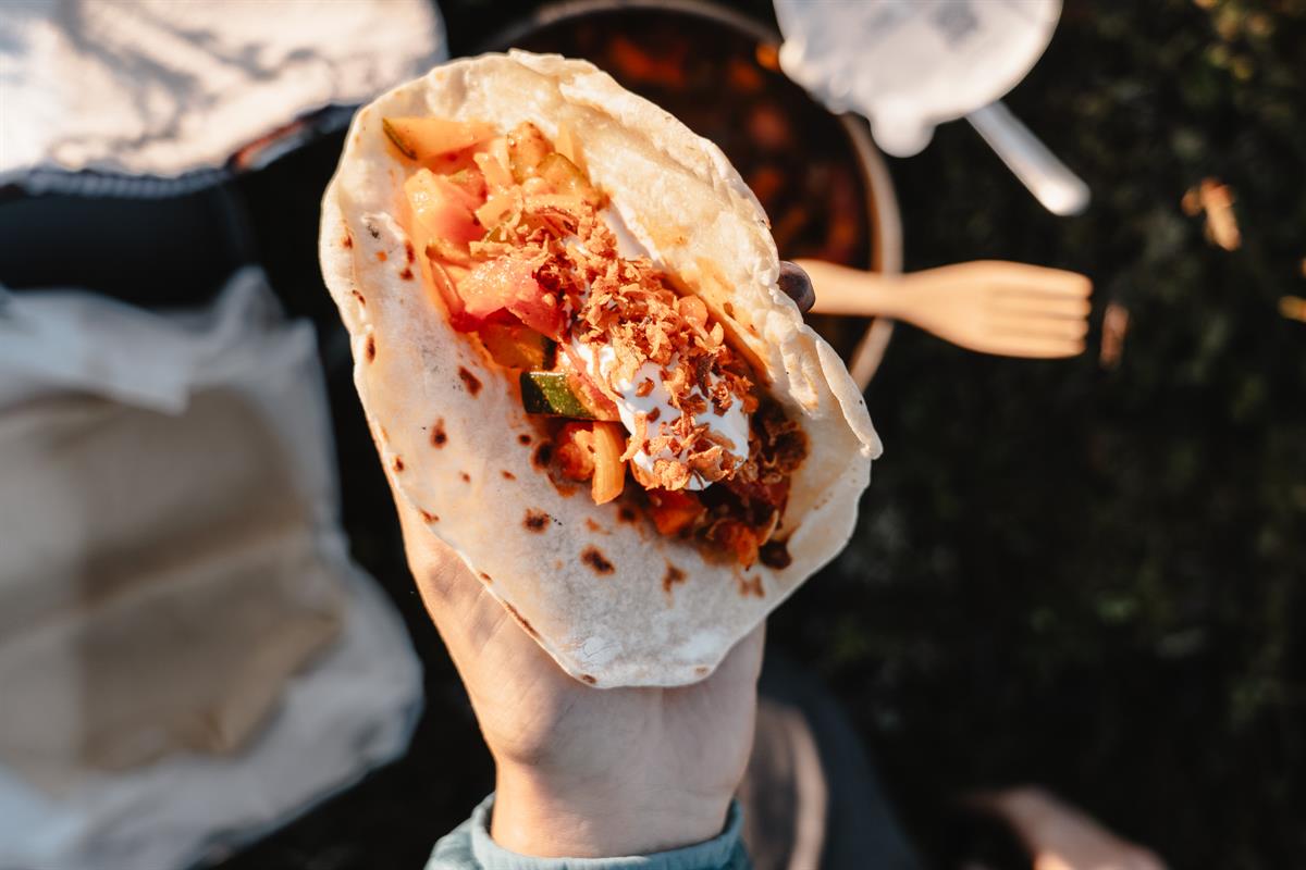 Wrap with meat and vegetables held in hand