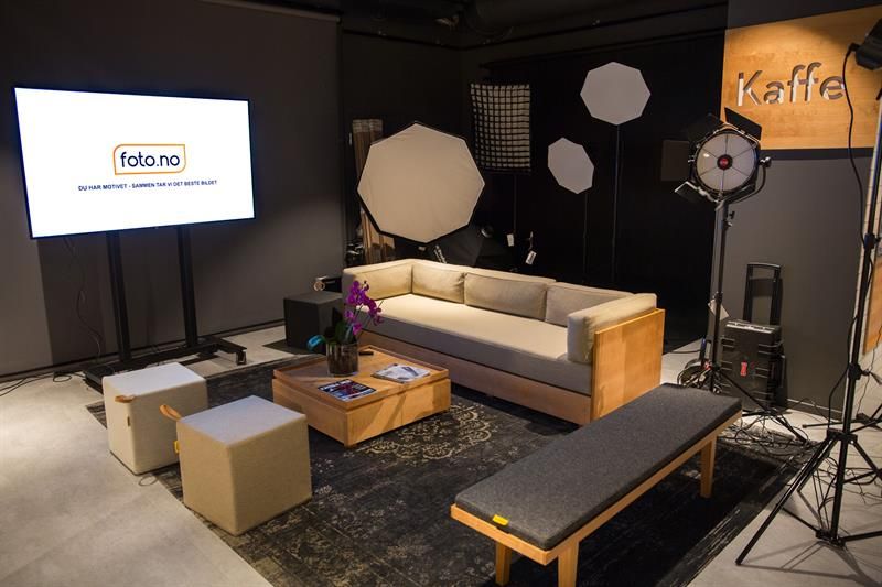 Seating section with lighting equipment and a screen.