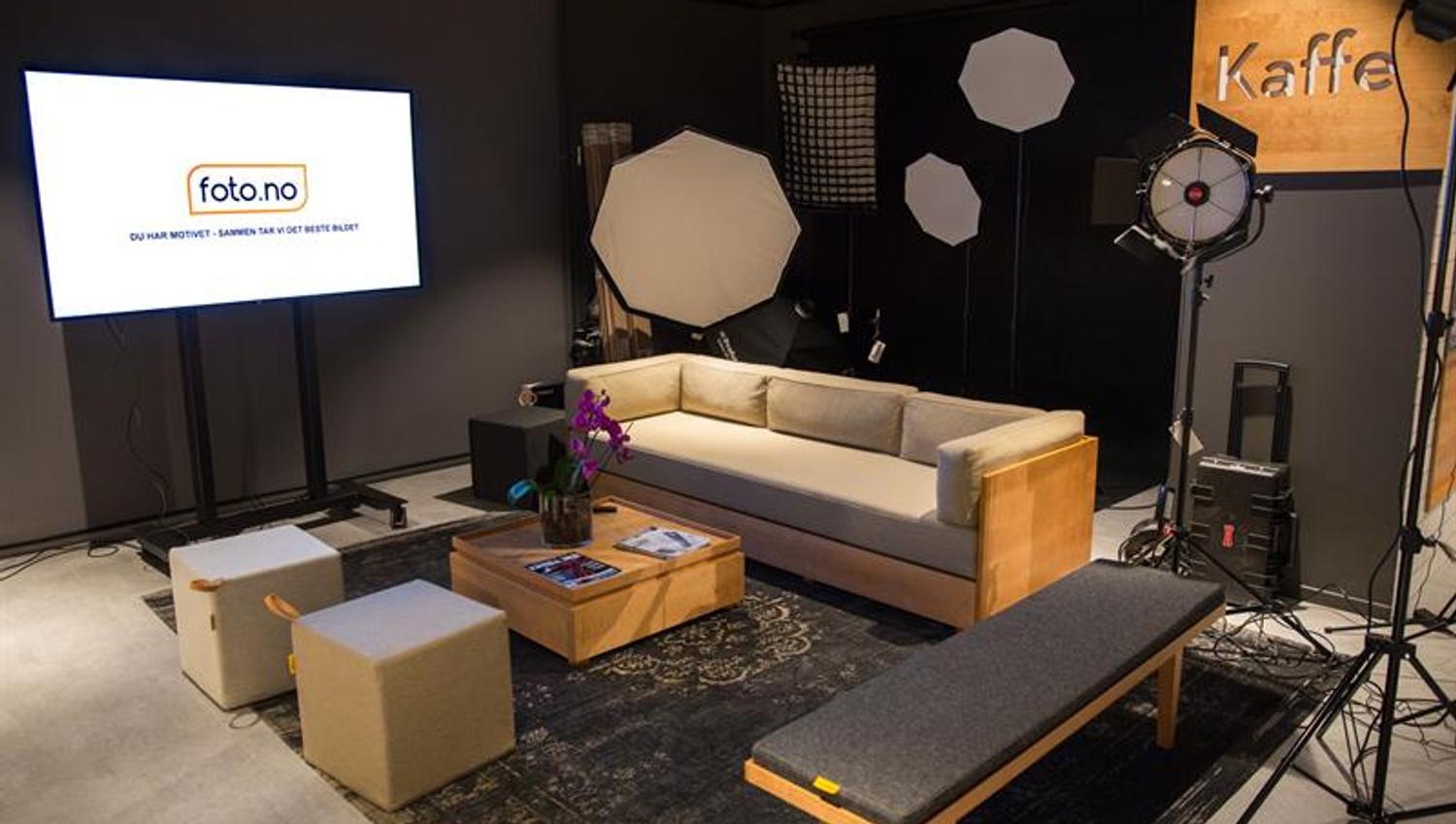 Seating section with lighting equipment and a screen.