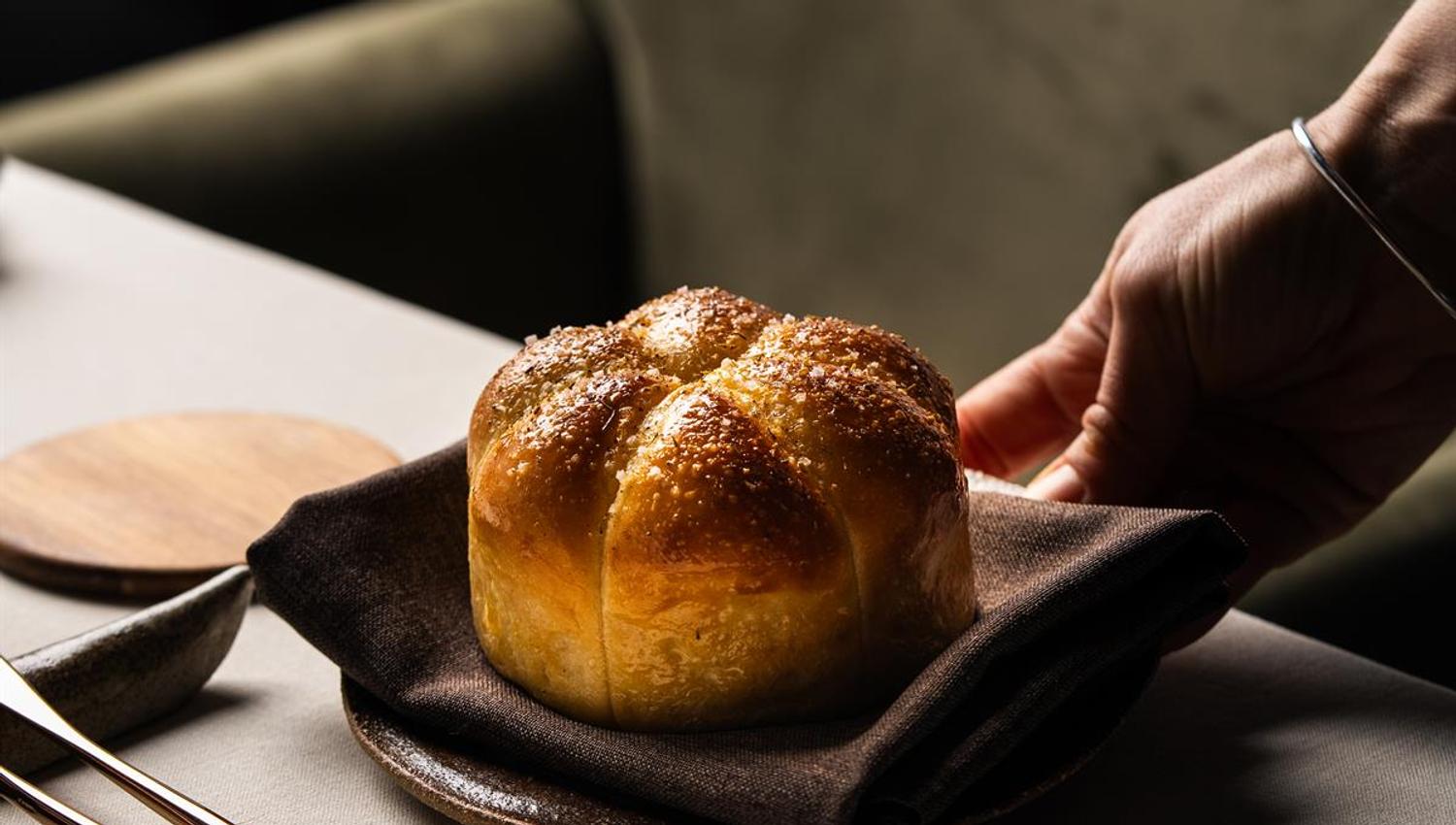Freshly baked bread served on a plate.