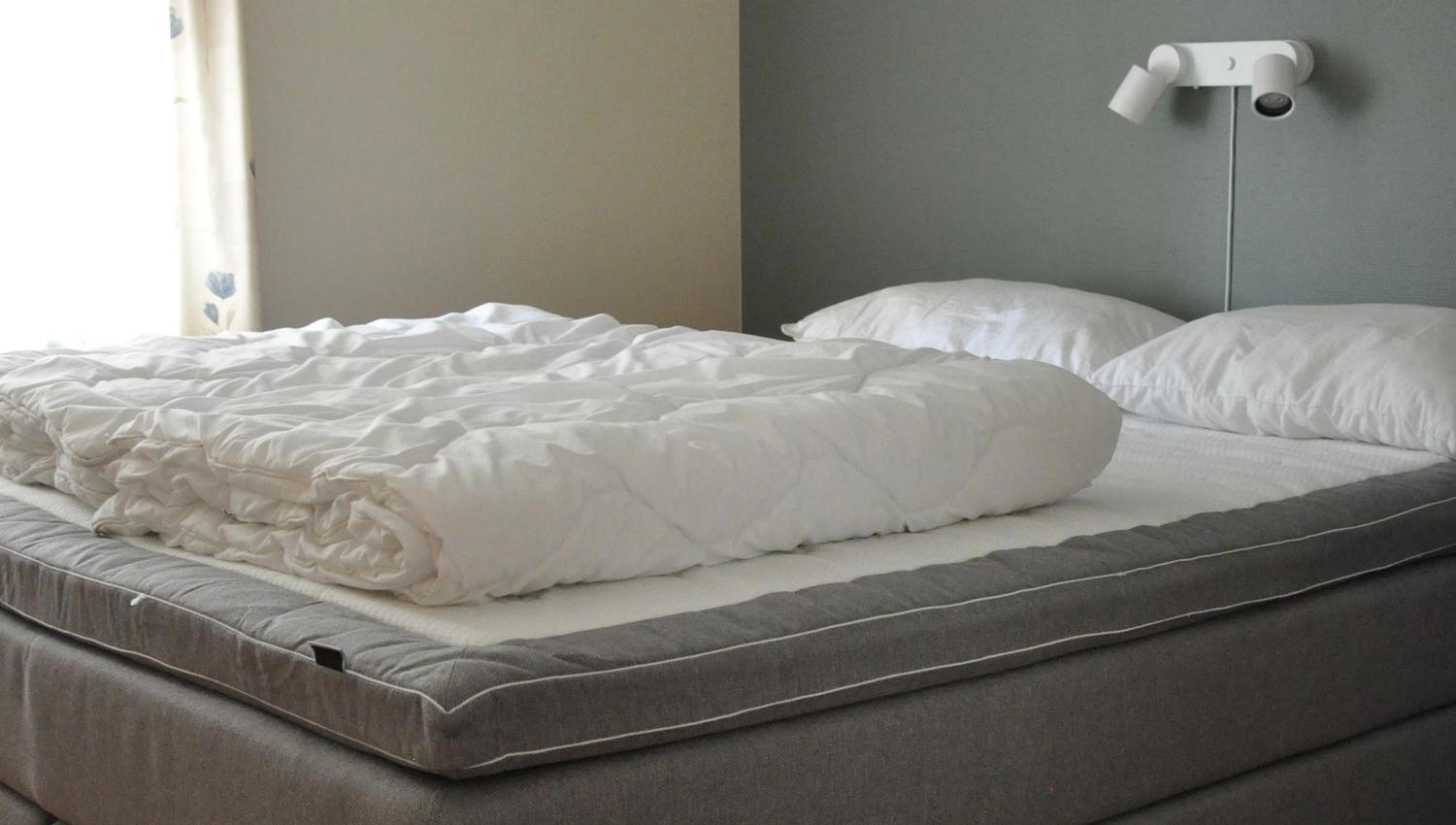 A double bed in a light and bright bed room