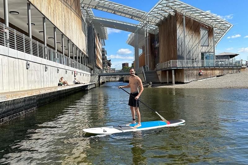 A man standing on a SUP board