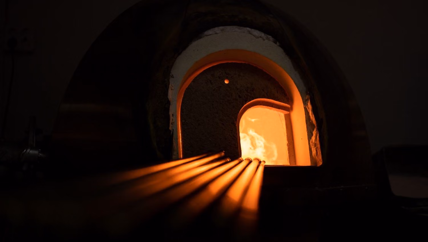 Glowing glass furnace at Blåst Glass Studio in Tromsø, where high temperatures are used to create handcrafted glass products.