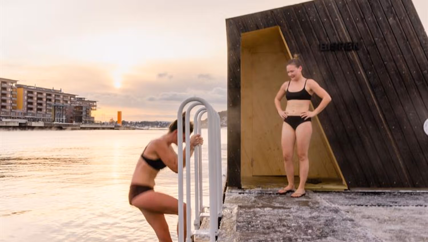 Two women bathing during winter