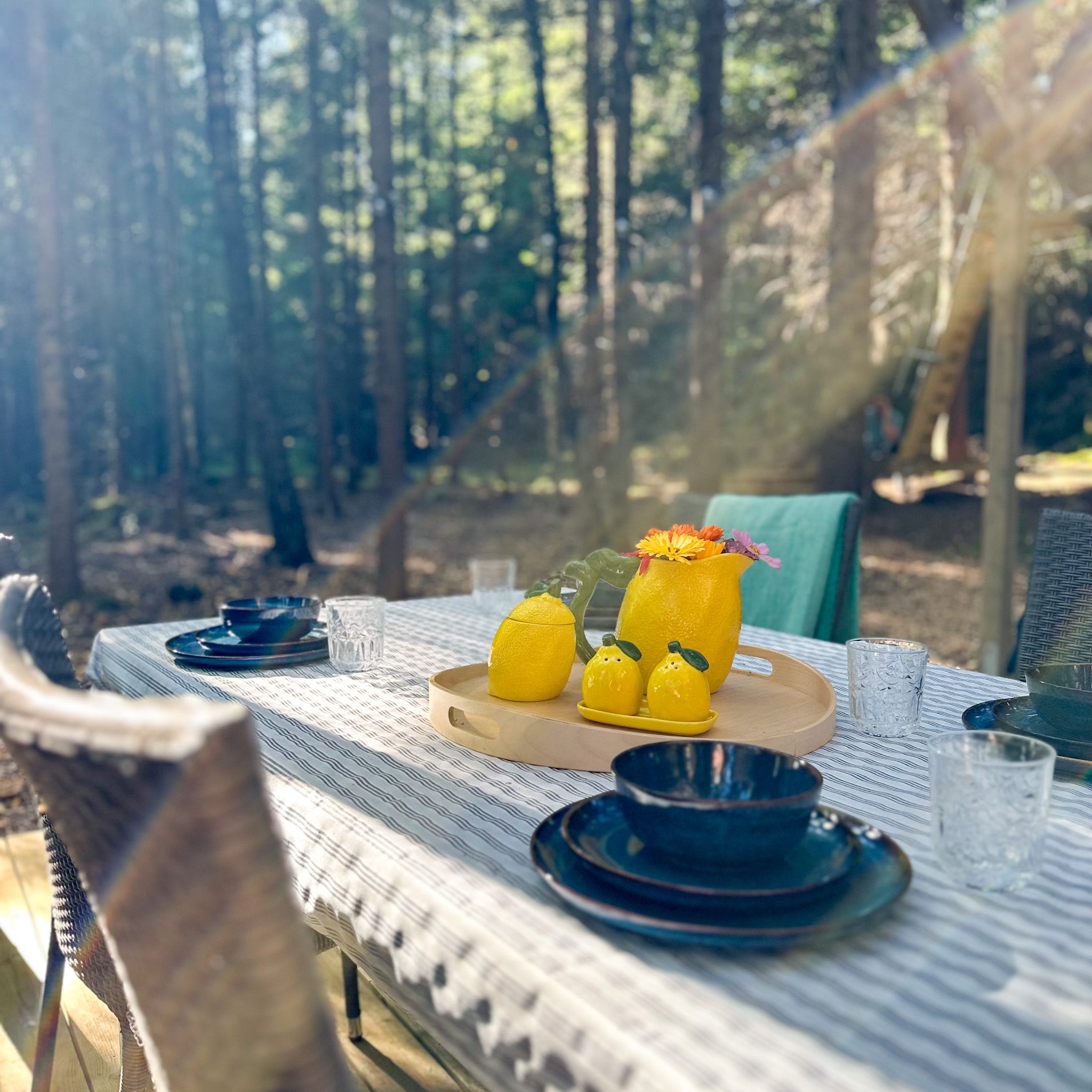 Tables and chairs covered with cups and plates
