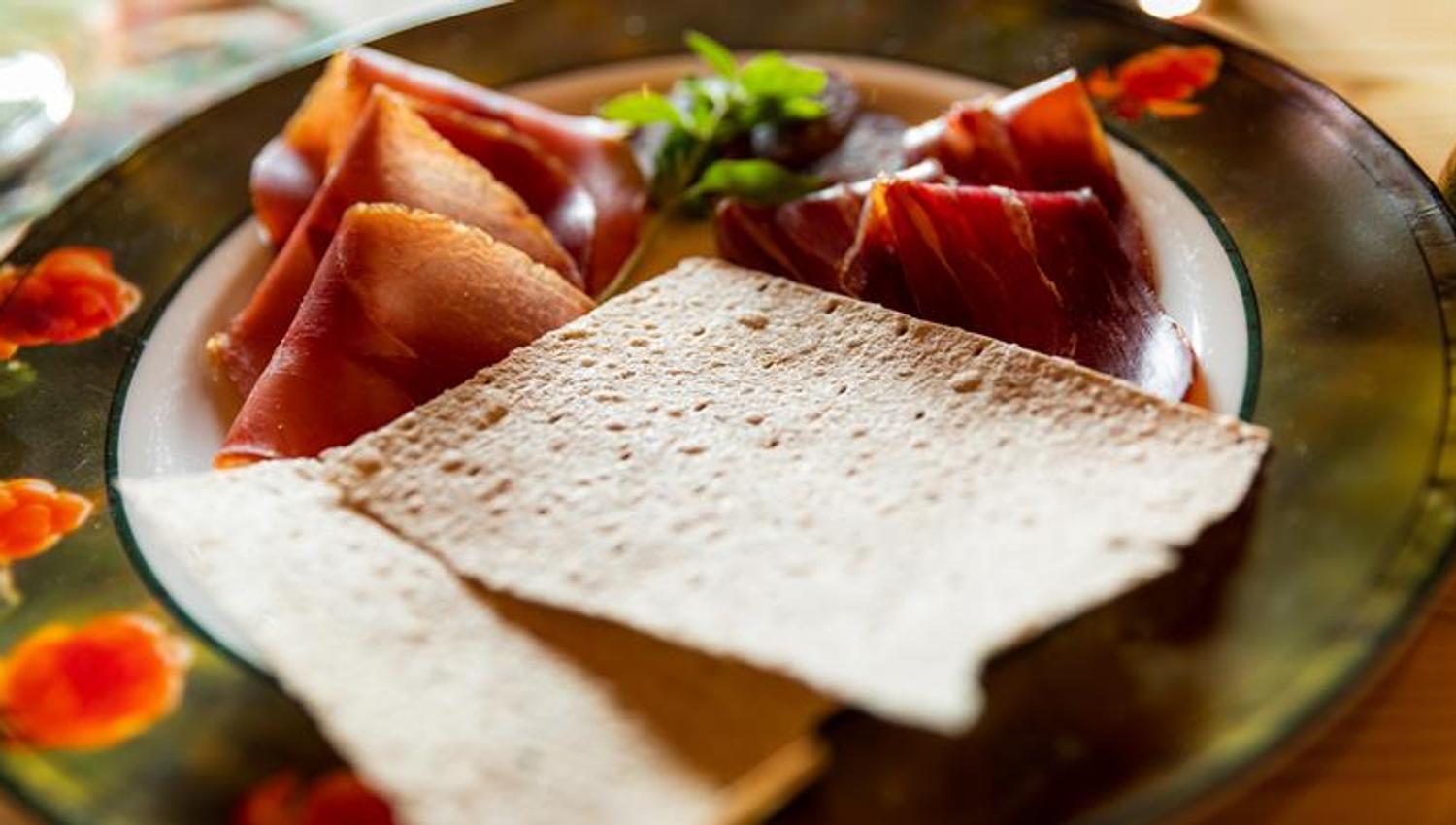 plate with sour cream porridge and ham