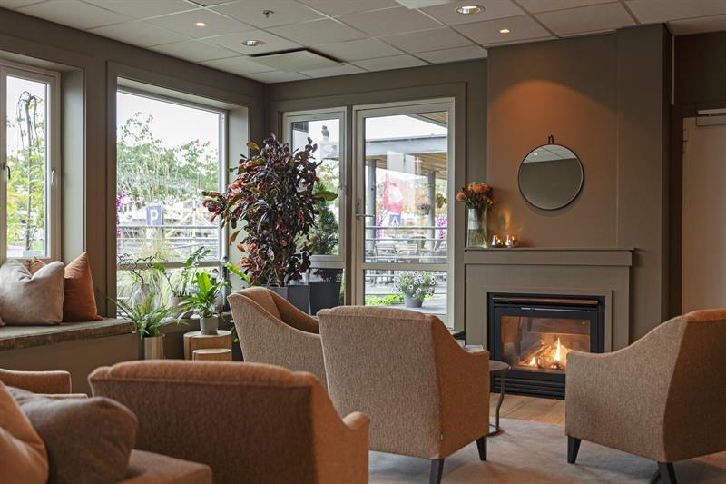 the fireplace in the lounge at the Home Hotel Bryggeparken