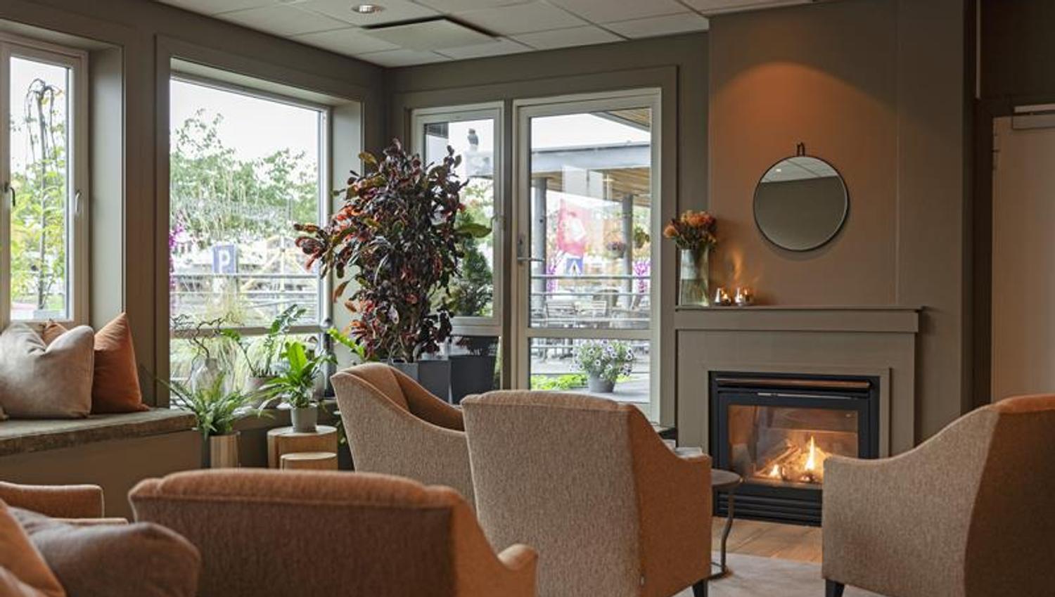 the fireplace in the lounge at the Home Hotel Bryggeparken
