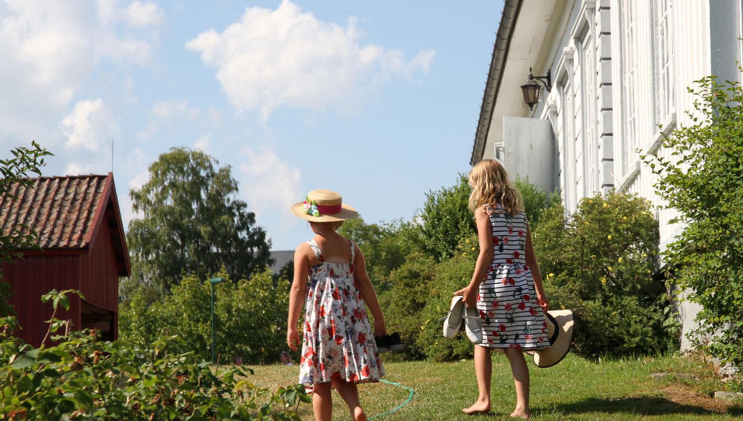 Girls in the garden at Henrik Ibsen Museum Venstøp in Skien
