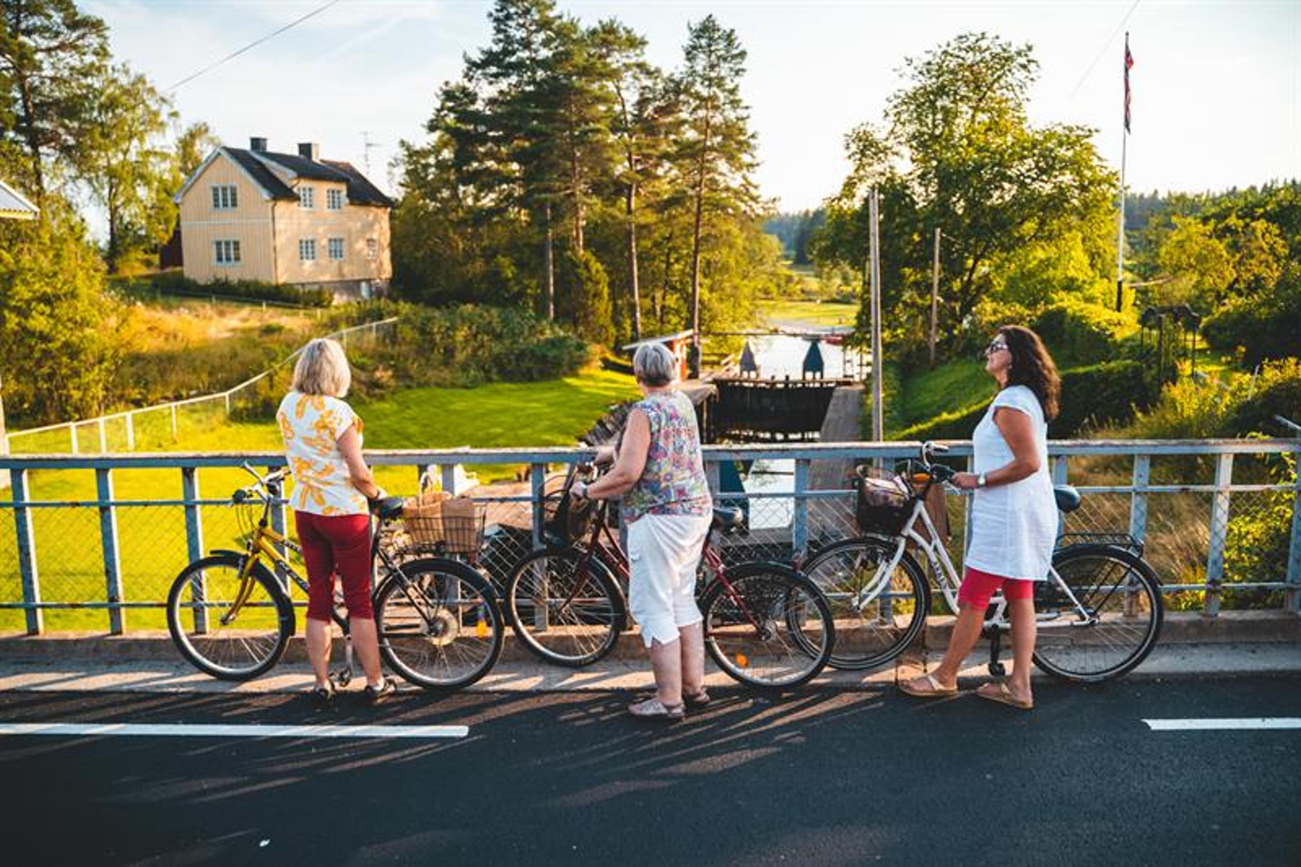 Three women with their bikes