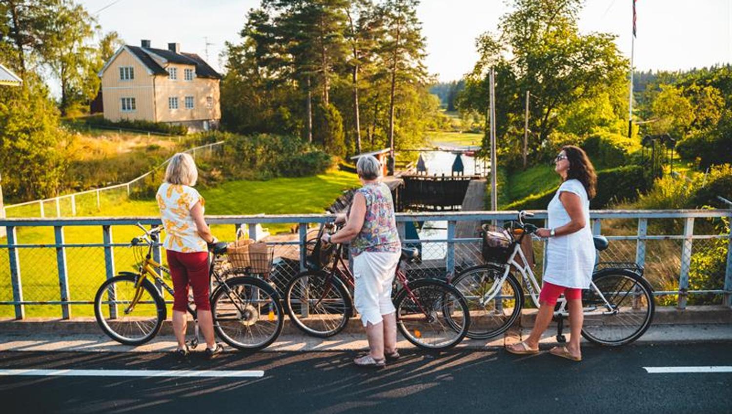 Three women with their bikes